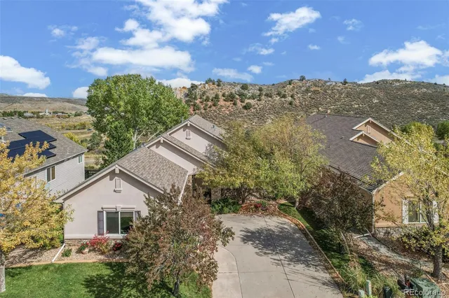 a pathway of a house with a yard