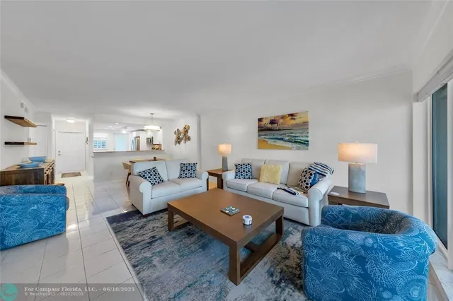 a living room with furniture and a lamp