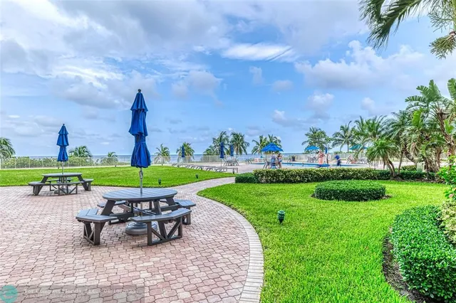 a view of a chairs and table in the garden