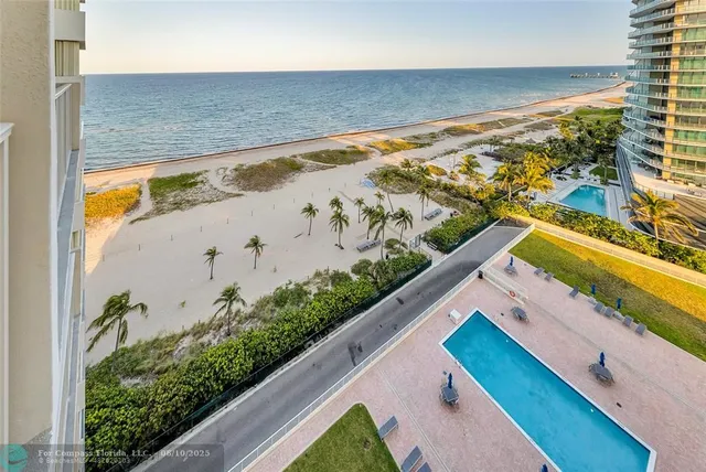 a view of swimming pool with outdoor seating