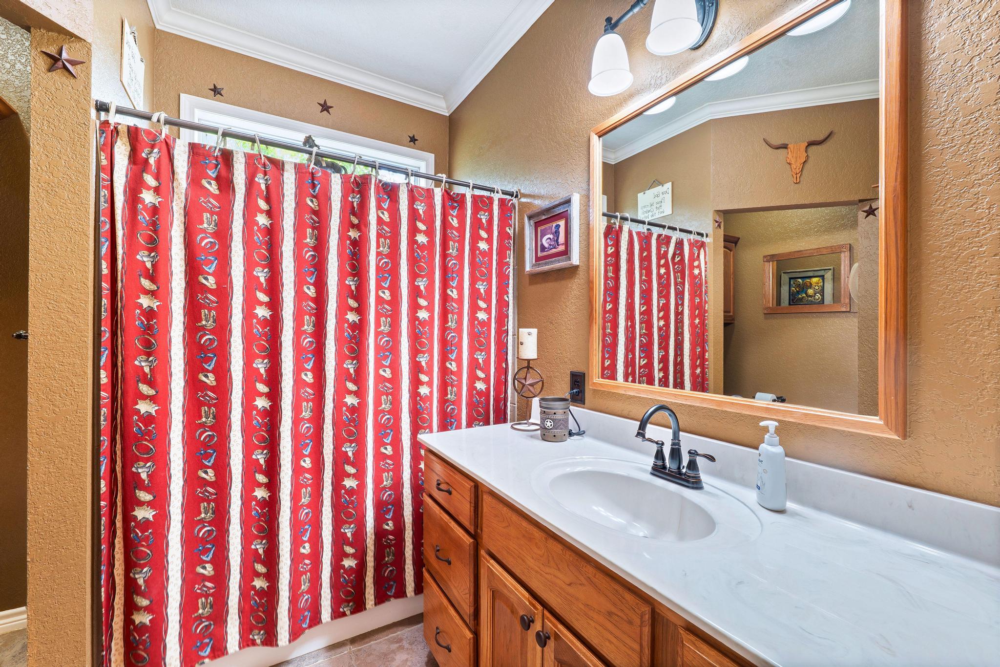 19000 Farm To Market Road 971 Granger, TX 76530 - Photo 23 of 40 The second full bath offers a shower/tub combo.