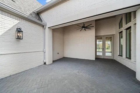 a view of a house with a ceiling fan