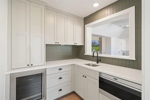 a view of a sink and mirror