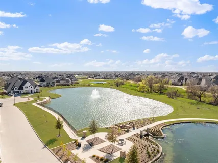 a view of a swimming pool and lake in back