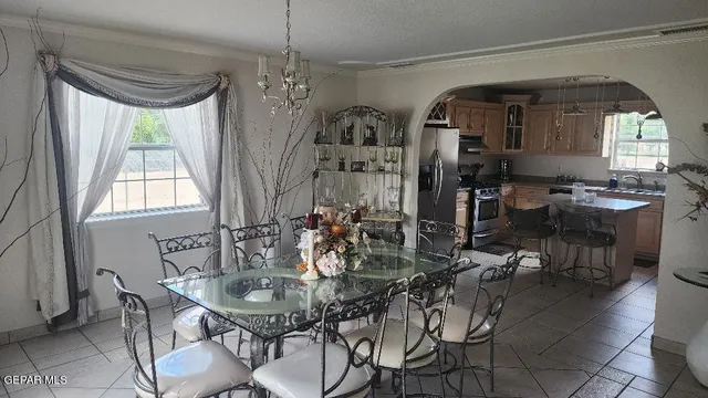 a view of a dining room with furniture and window