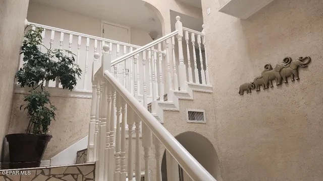 a view of entryway with wooden floor and stairs