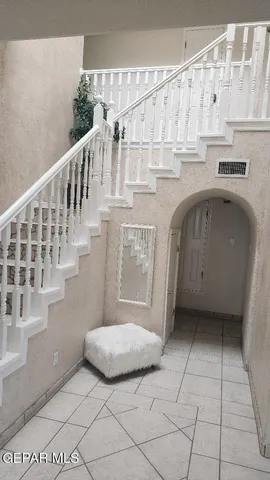 a view of entryway with kitchen