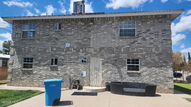 a brick building with glass door