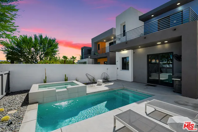 a backyard of a house with seating space