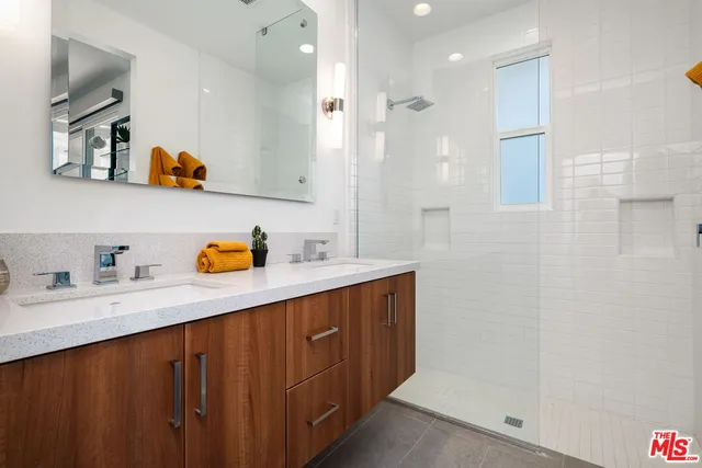 a bedroom with a bed and a chair