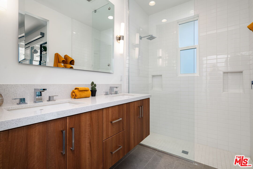 504 Paragon Loop Palm Springs, CA 92262 - Photo 14 of 19 a white kitchen with a sink a refrigerator and wooden floor