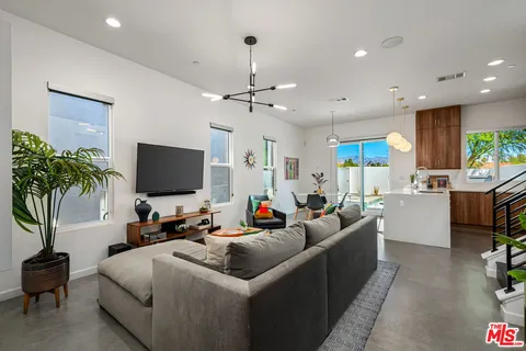 a very nice looking dining room with a table and chairs