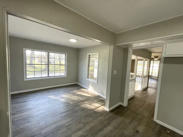 a view of an empty room and glass door