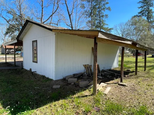 a backyard of a house with wooden fence