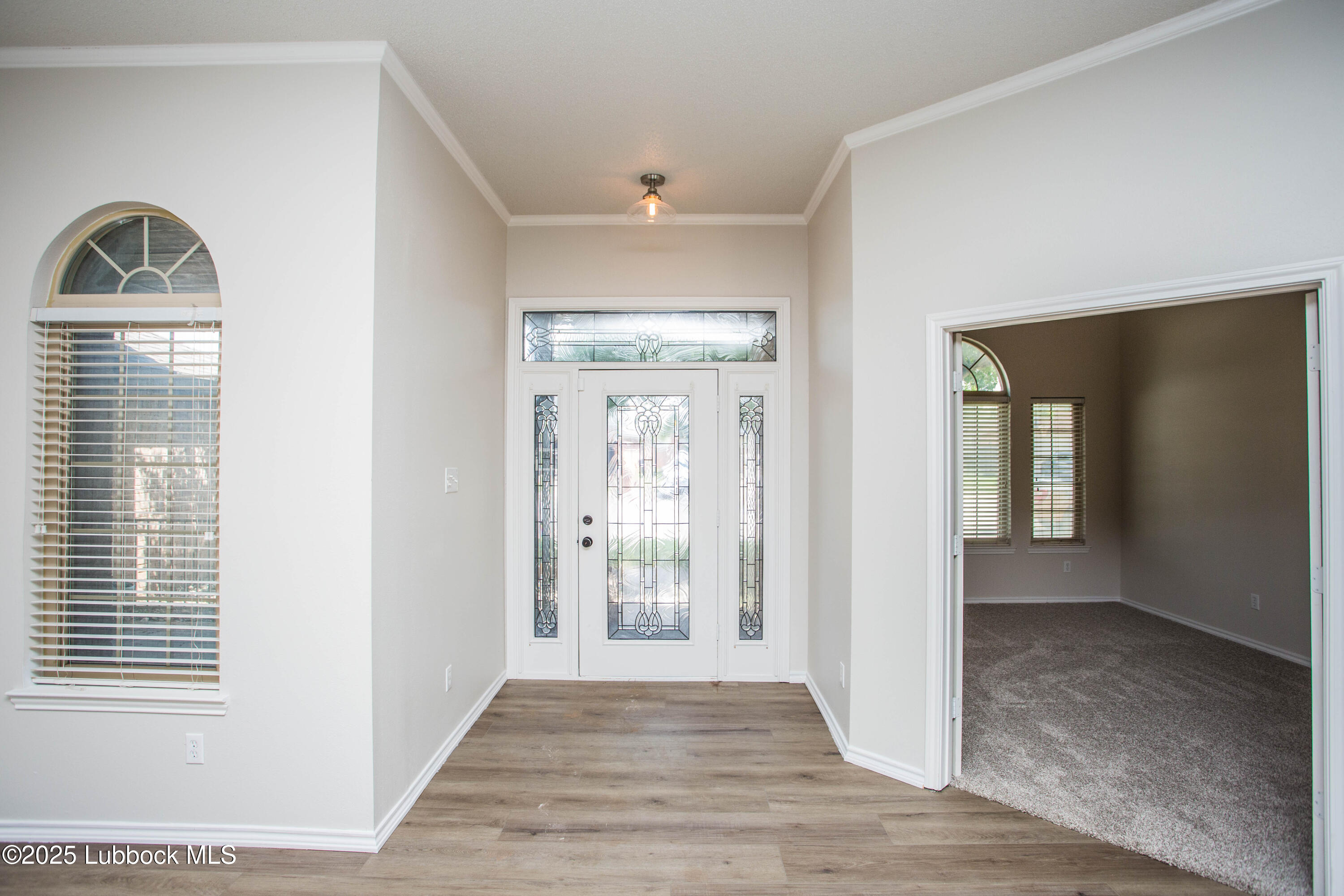 616 North 8th Street Wolfforth, TX 79382 - Photo 11 of 50 a view of an entryway with wooden floor