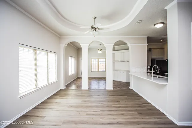 a large kitchen with kitchen island a sink stainless steel appliances and cabinets