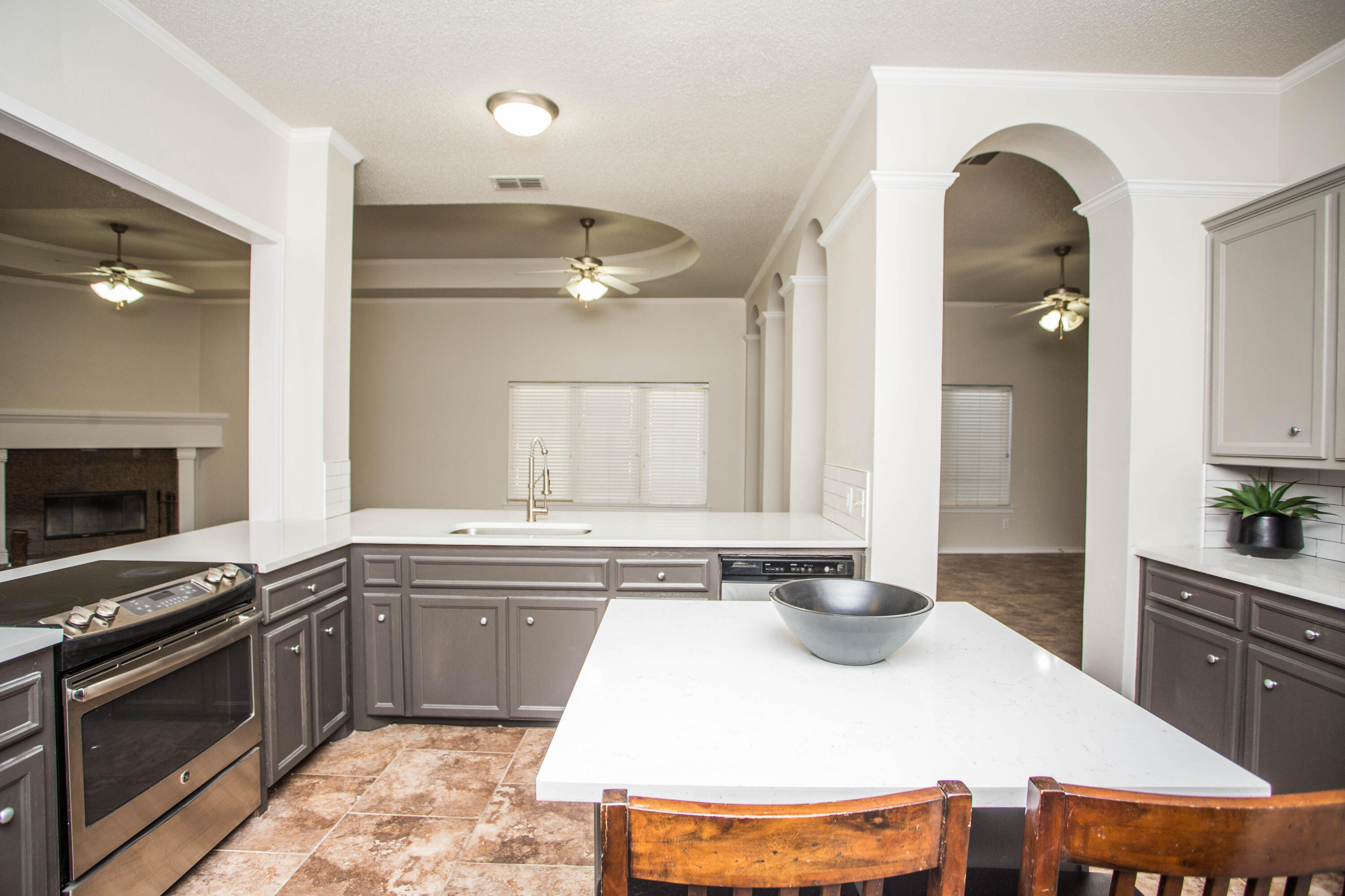 616 North 8th Street Wolfforth, TX 79382 - Photo 19 of 50 a kitchen with a stove a sink and a refrigerator