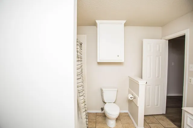 a bathroom with a tub sink and shower