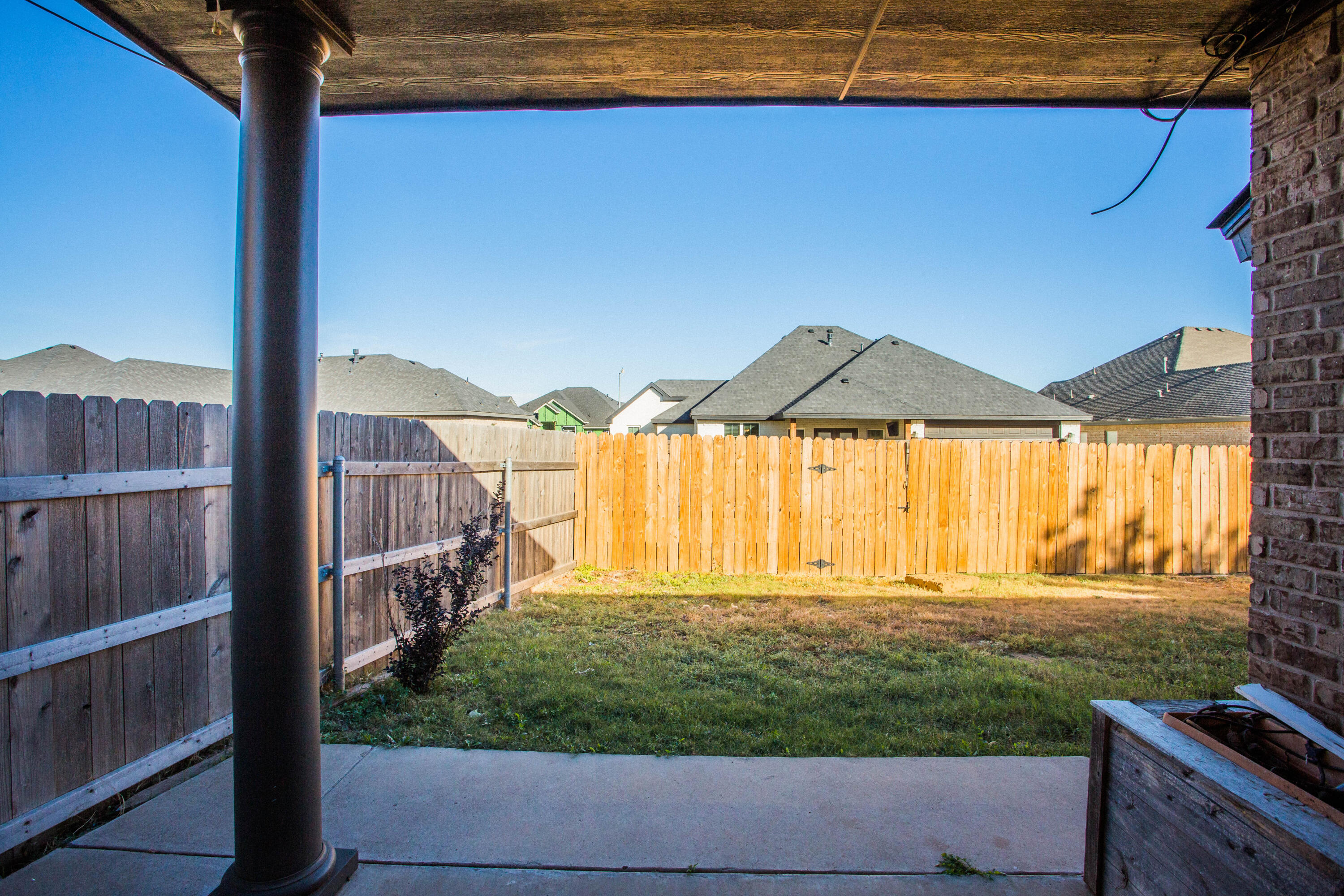 616 North 8th Street Wolfforth, TX 79382 - Photo 46 of 50 a view of a house with a small yard and wooden fence