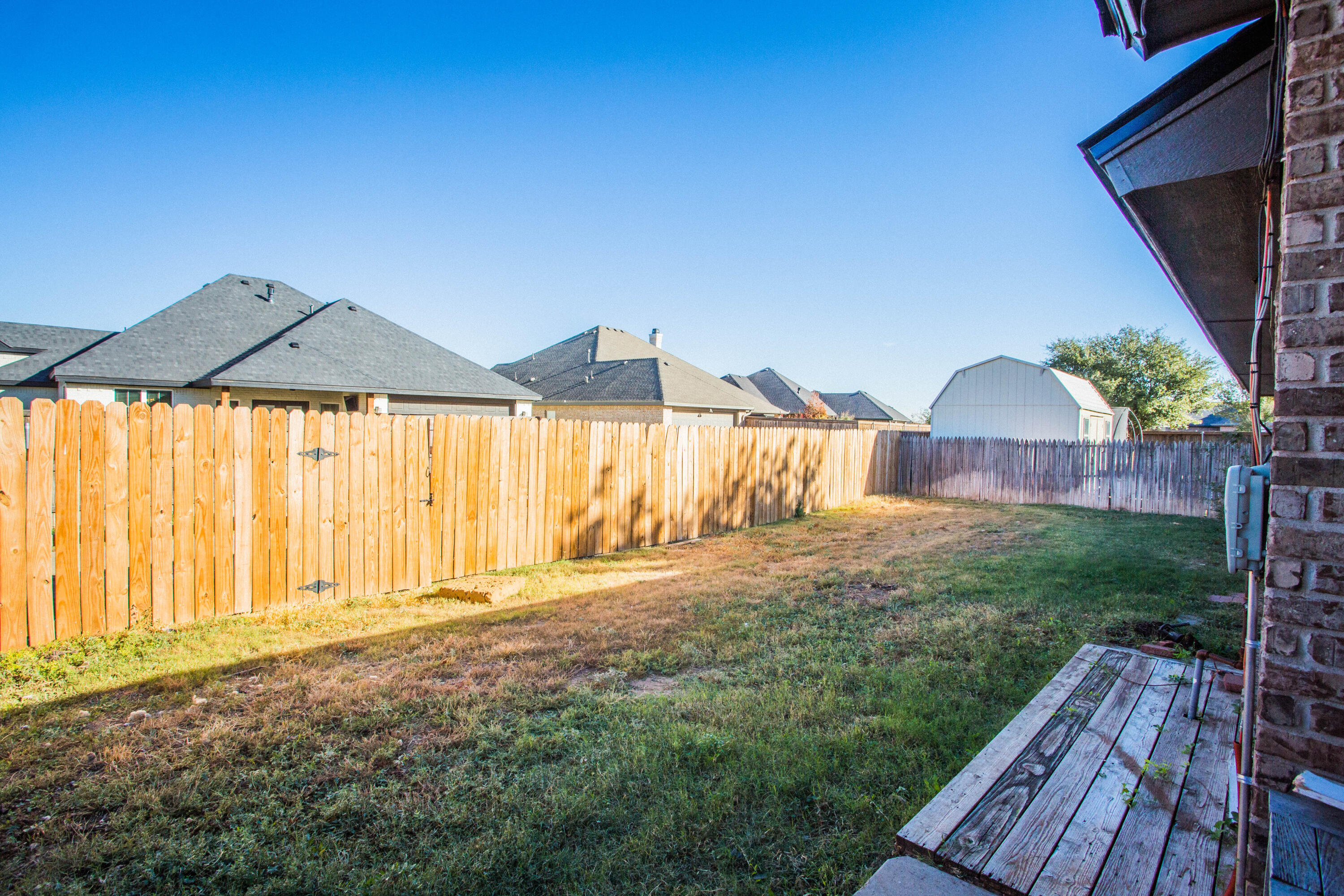 616 North 8th Street Wolfforth, TX 79382 - Photo 47 of 50 a view of a house with backyard and wooden floor