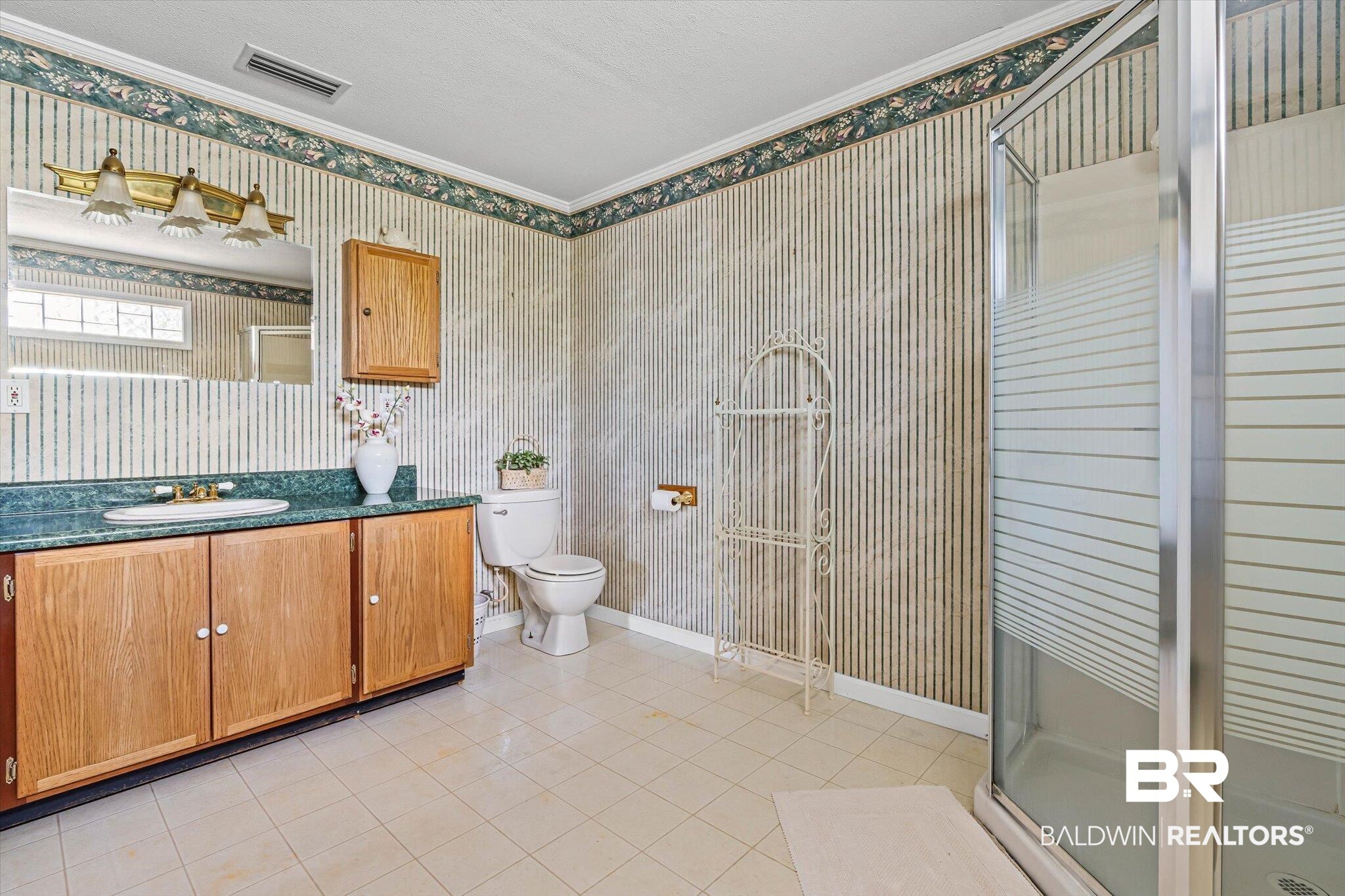 431 Simms Drive Saraland, AL 36571 - Photo 13 of 34 Full bath with wallpapered walls, a stall shower, light tile patterned floors, vanity, and ornamental molding