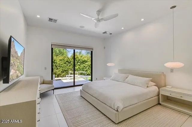 a bedroom with a bed and a stove