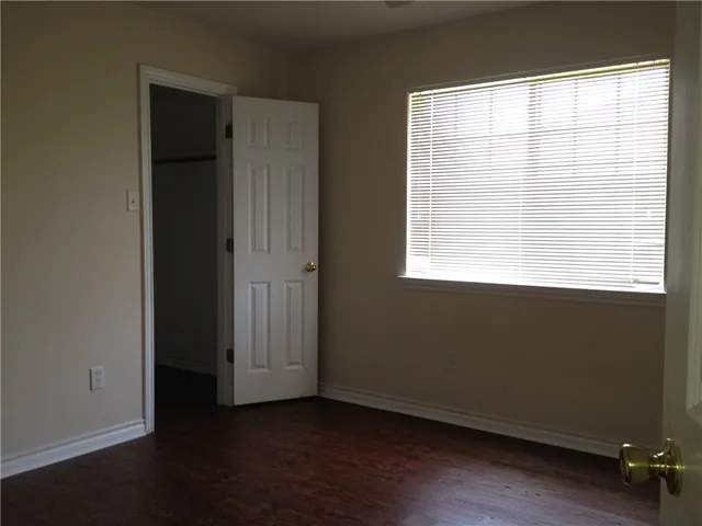 wooden floor and window in an empty room