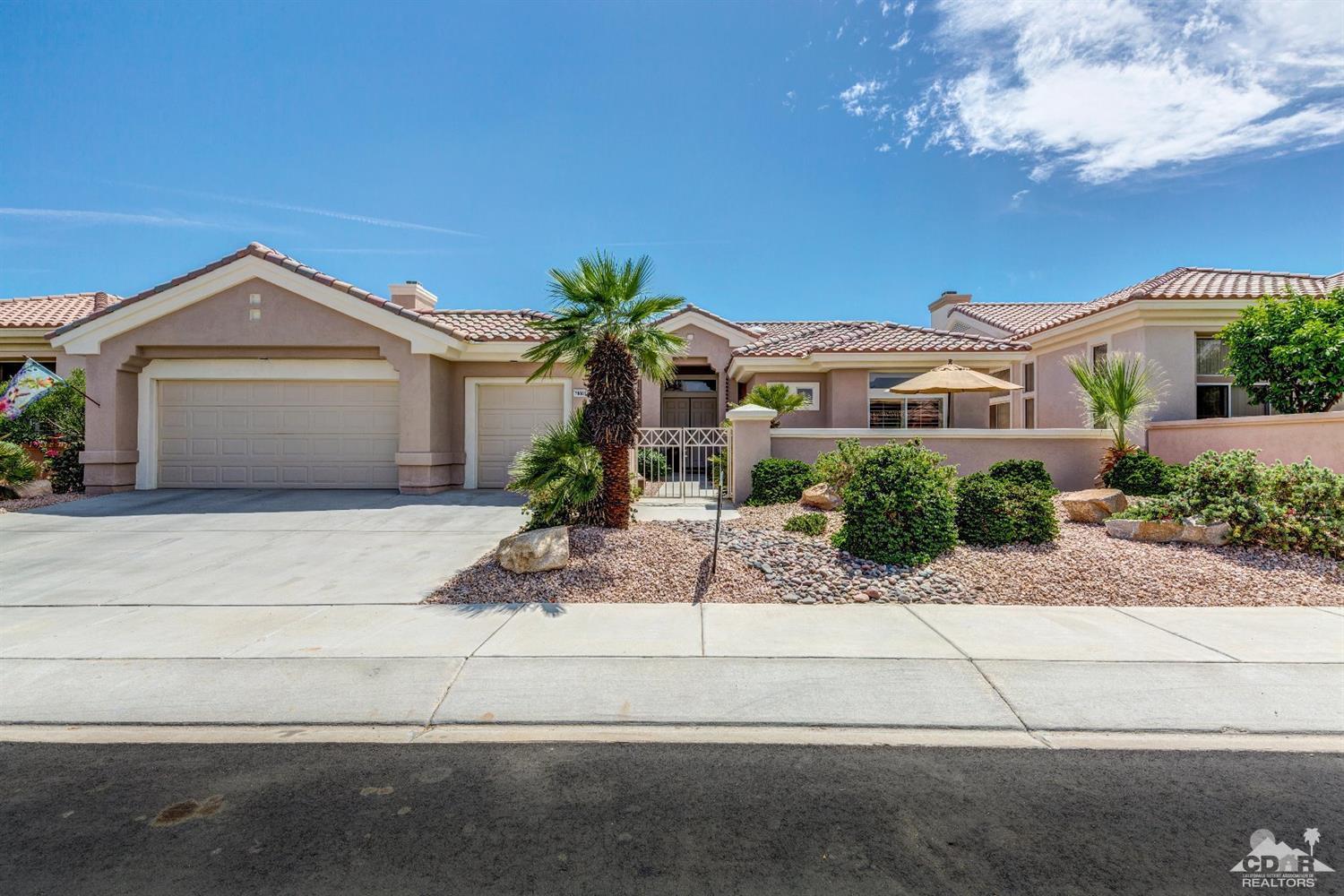 78087 Hunter Point Road Palm Desert, CA 92211 - Photo 1 of 37 a front view of a house with a yard and garage