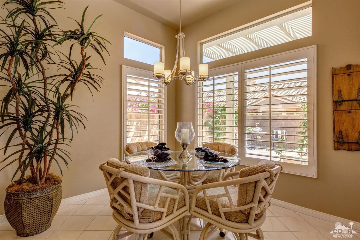 78087 Hunter Point Road Palm Desert, CA 92211 - Photo 12 of 37 a view of a dining room with furniture and windows