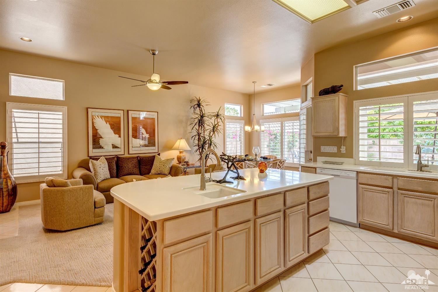 78087 Hunter Point Road Palm Desert, CA 92211 - Photo 13 of 37 a kitchen with sink refrigerator and window