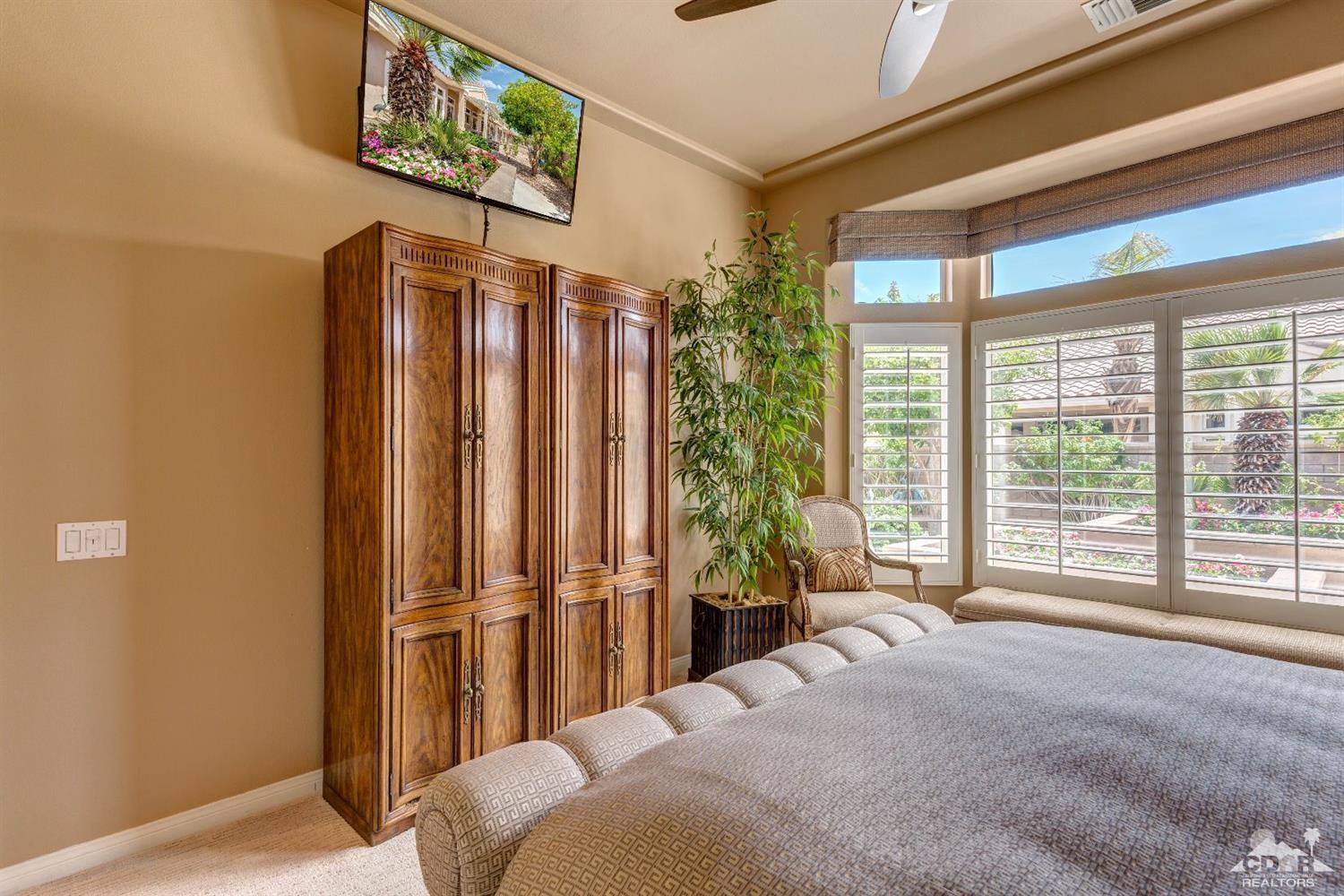 78087 Hunter Point Road Palm Desert, CA 92211 - Photo 18 of 37 a bedroom with a bed and a large window