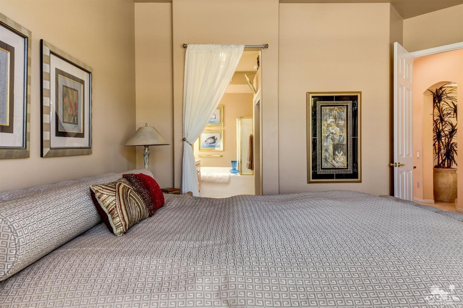 78087 Hunter Point Road Palm Desert, CA 92211 - Photo 19 of 37 a bedroom with a bed and a couch