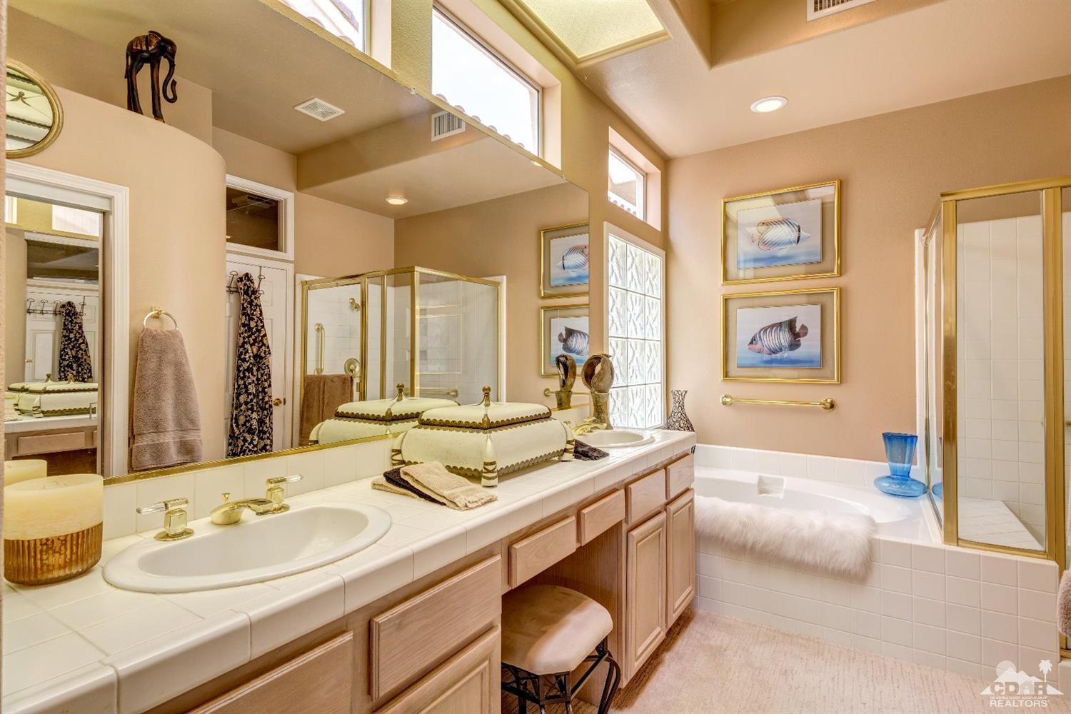 78087 Hunter Point Road Palm Desert, CA 92211 - Photo 20 of 37 a bathroom with a granite countertop sink and a mirror