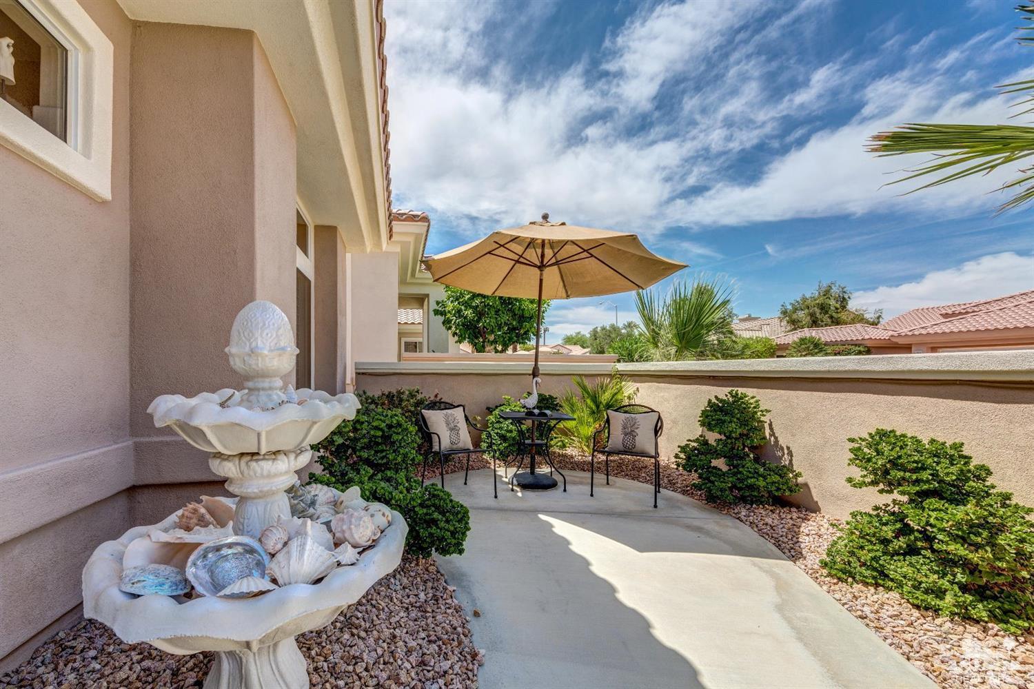 78087 Hunter Point Road Palm Desert, CA 92211 - Photo 3 of 37 a view of a chairs and table in backyard