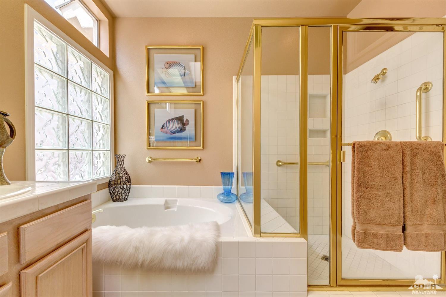 78087 Hunter Point Road Palm Desert, CA 92211 - Photo 21 of 37 a bathroom with a tub and a window