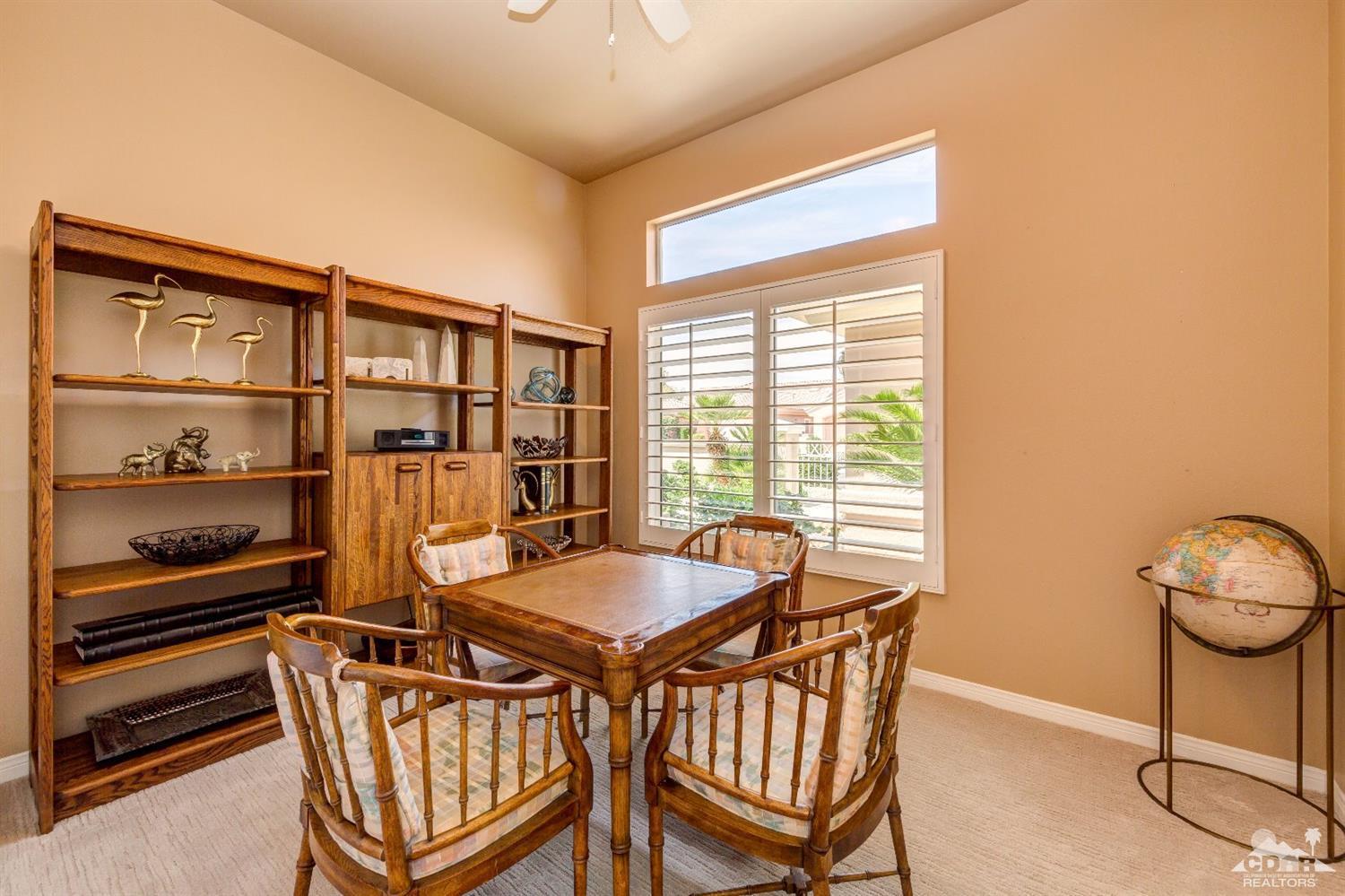 78087 Hunter Point Road Palm Desert, CA 92211 - Photo 26 of 37 a dining room with furniture and window