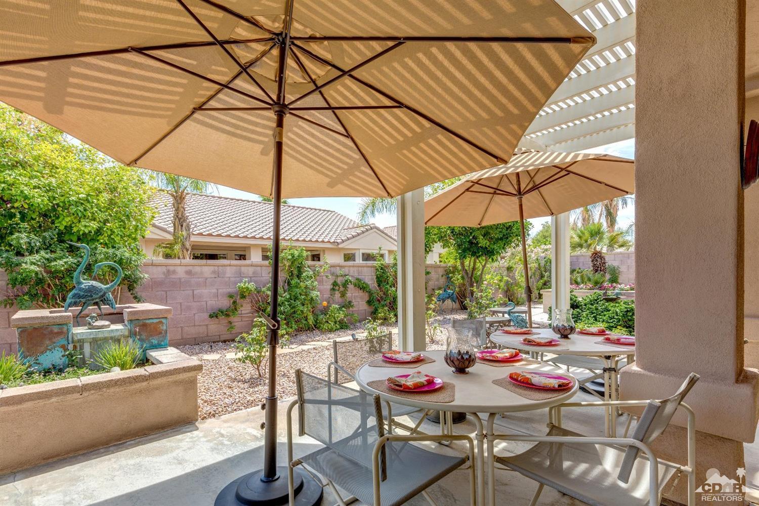 78087 Hunter Point Road Palm Desert, CA 92211 - Photo 29 of 37 a view of an outdoor sitting area with furniture and backyard