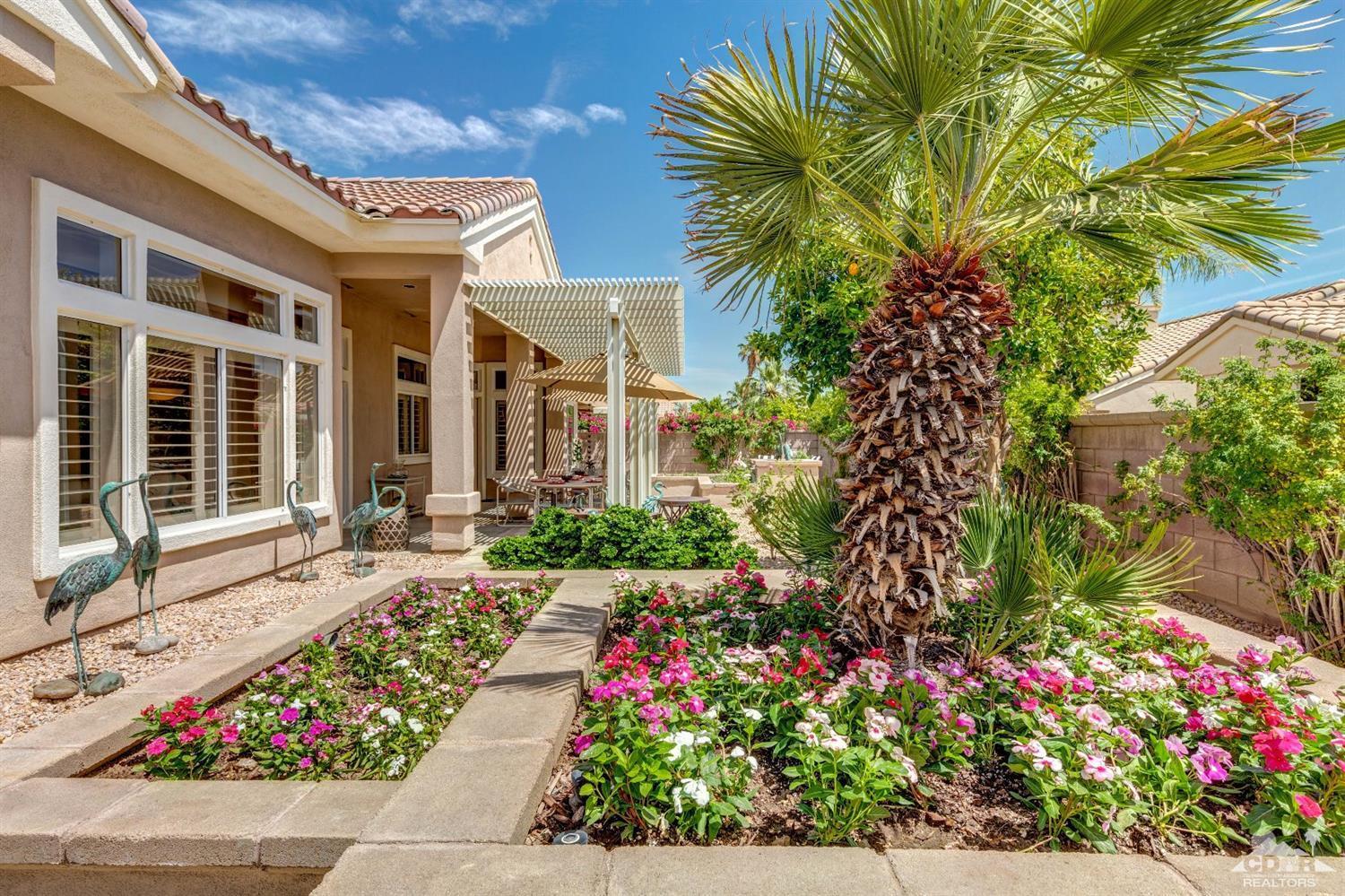 78087 Hunter Point Road Palm Desert, CA 92211 - Photo 33 of 37 front view of a house with a yard