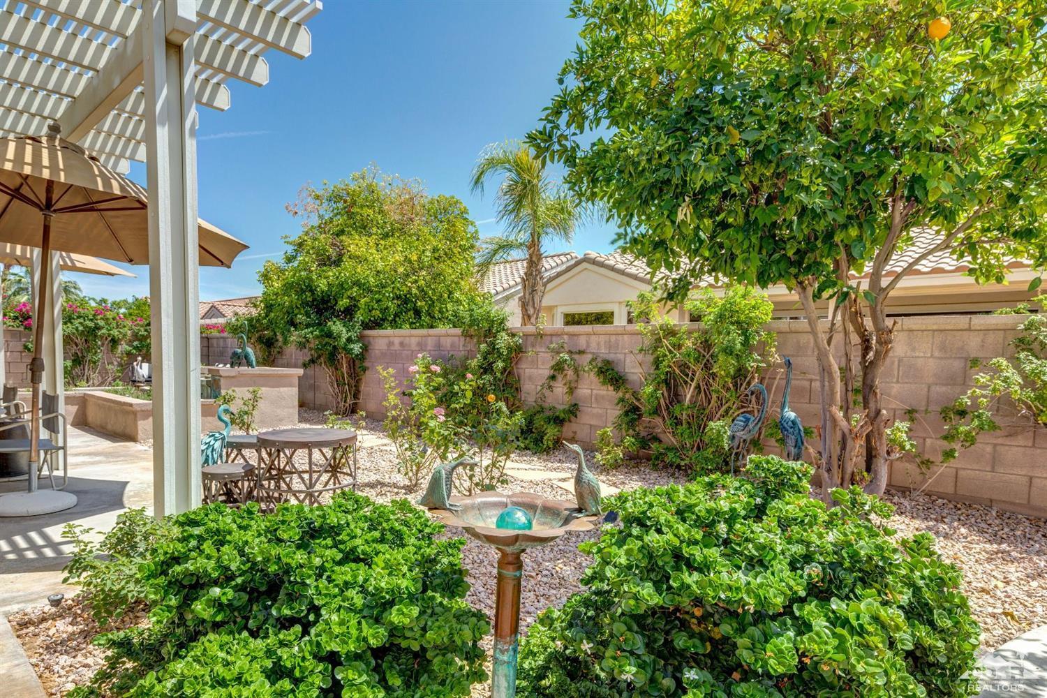 78087 Hunter Point Road Palm Desert, CA 92211 - Photo 34 of 37 a view of a garden with a fountain