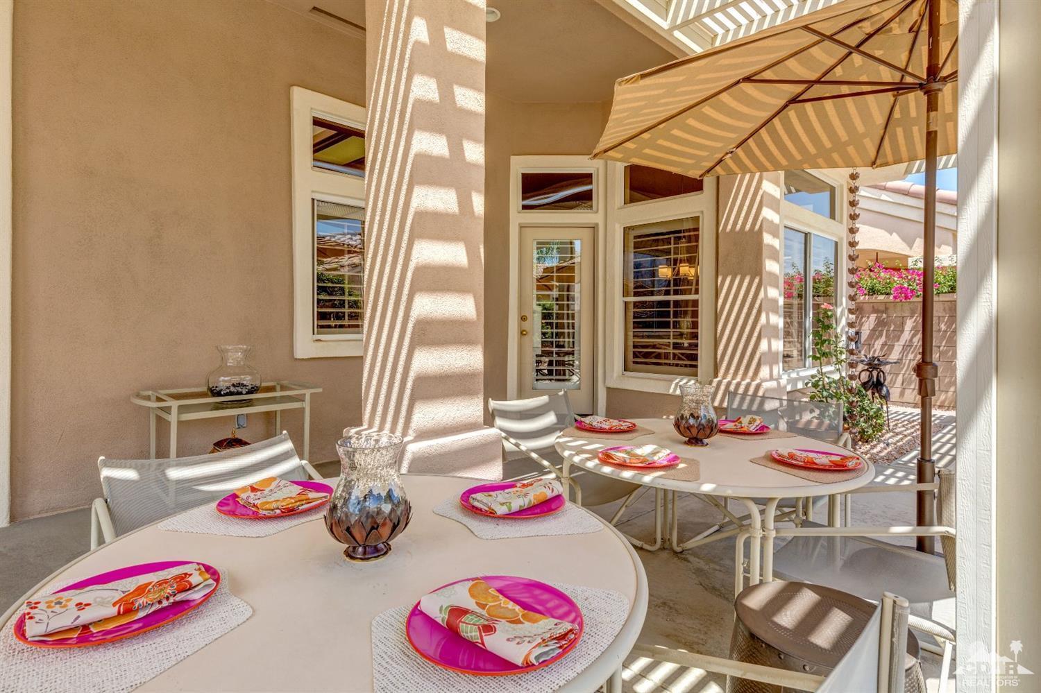 78087 Hunter Point Road Palm Desert, CA 92211 - Photo 35 of 37 a table and chairs in the patio
