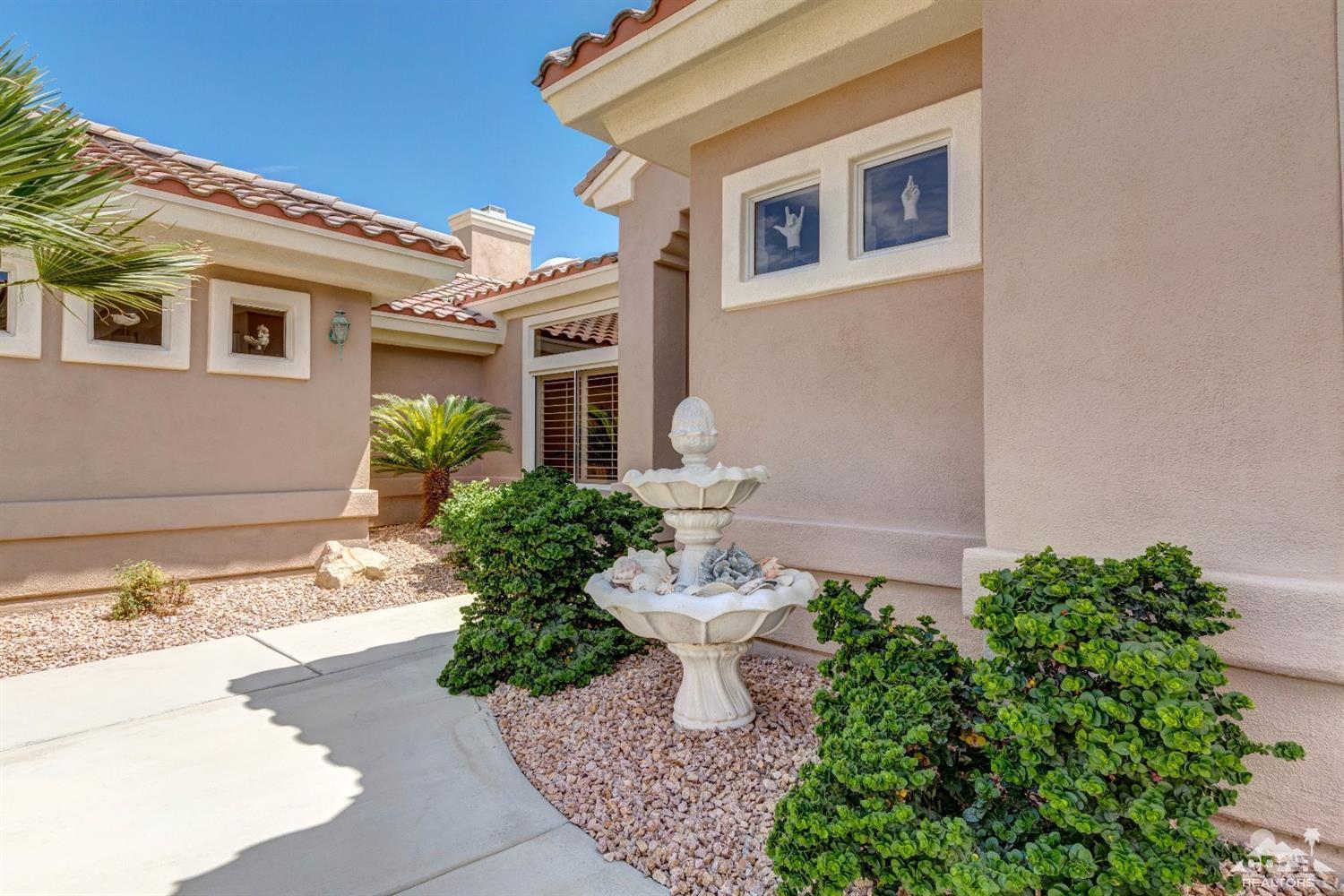 78087 Hunter Point Road Palm Desert, CA 92211 - Photo 37 of 37 a front view of a house with a yard