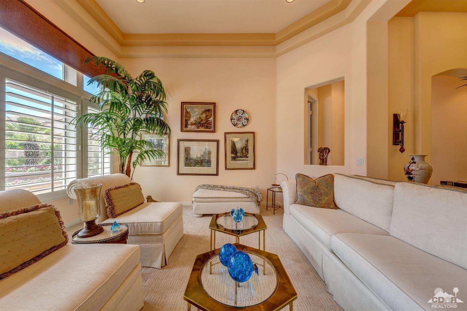 78087 Hunter Point Road Palm Desert, CA 92211 - Photo 5 of 37 a living room with furniture and a large window