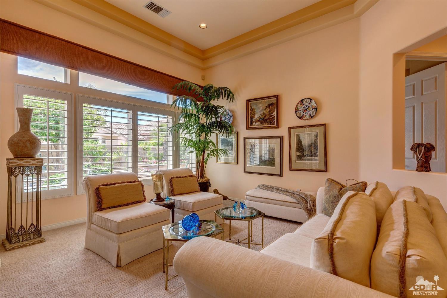 78087 Hunter Point Road Palm Desert, CA 92211 - Photo 6 of 37 a living room with furniture and a large window