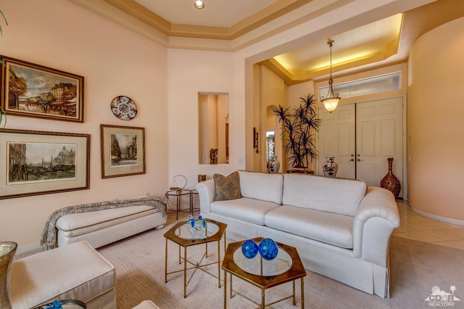 78087 Hunter Point Road Palm Desert, CA 92211 - Photo 7 of 37 a living room with furniture and a table