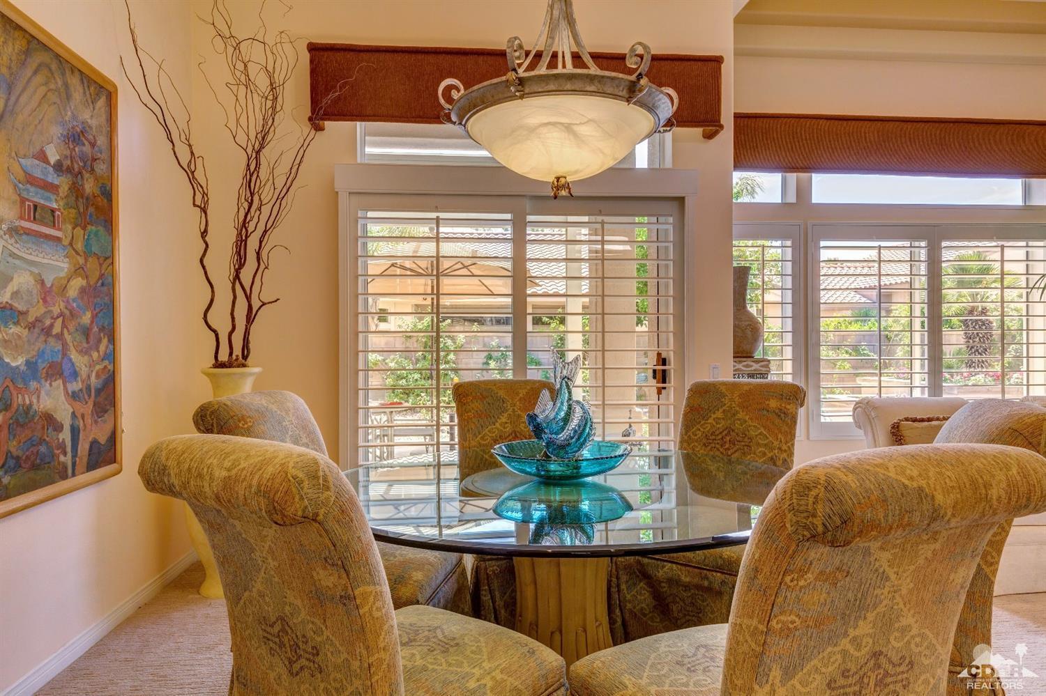 78087 Hunter Point Road Palm Desert, CA 92211 - Photo 8 of 37 a living room with furniture and a large window