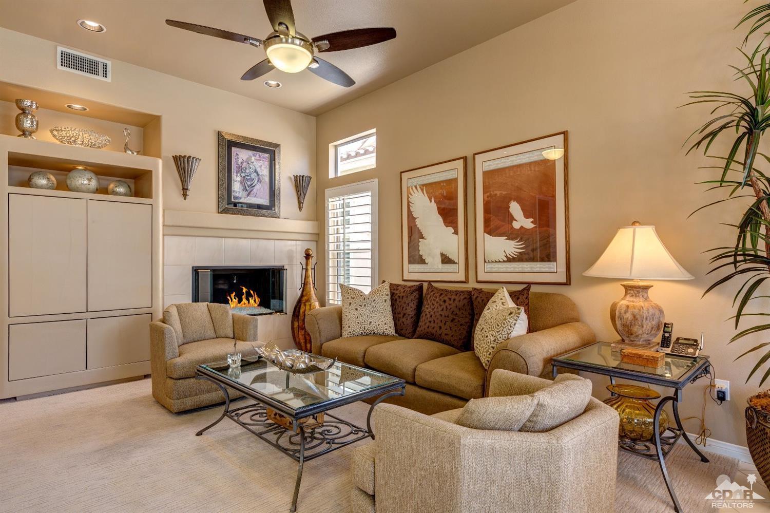 78087 Hunter Point Road Palm Desert, CA 92211 - Photo 10 of 37 a living room with furniture and a fireplace