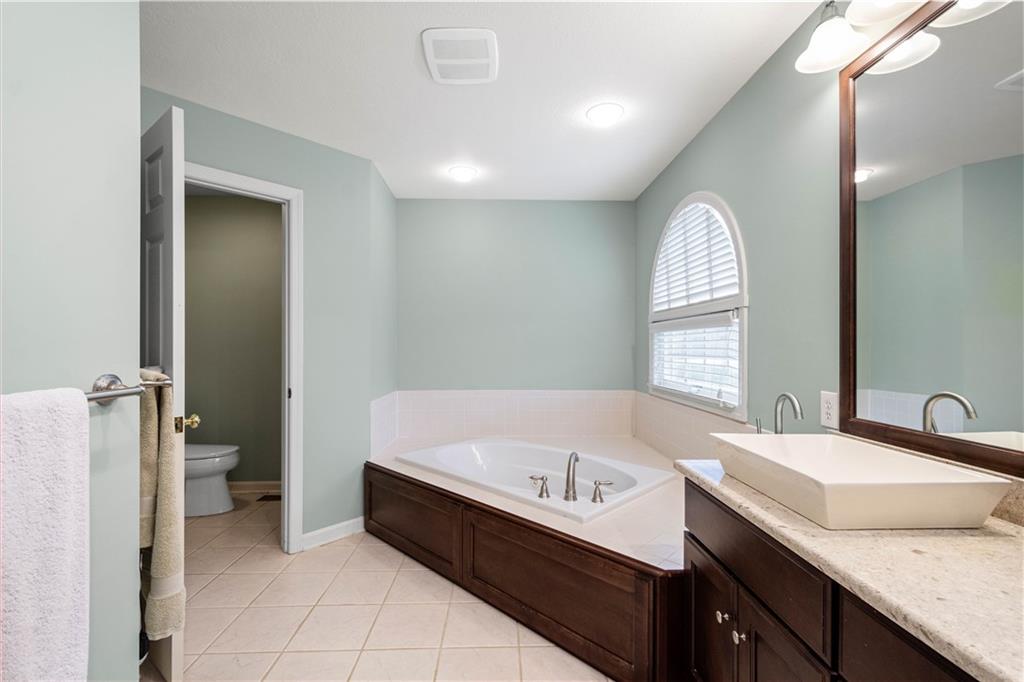 110 Walnut Drive Eighty Four, PA 15330 - Photo 23 of 50 a bathroom with a tub sink and mirror