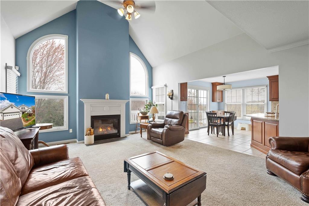 110 Walnut Drive Eighty Four, PA 15330 - Photo 10 of 50 a living room with furniture a fireplace and a large window
