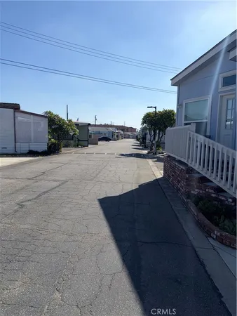 a view of backyard and car parked