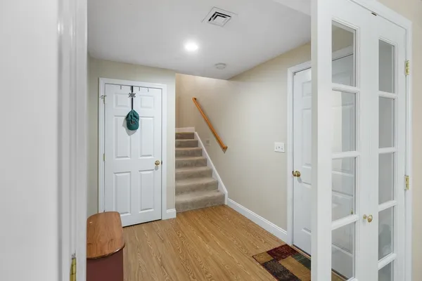 a view of entryway with wooden floor